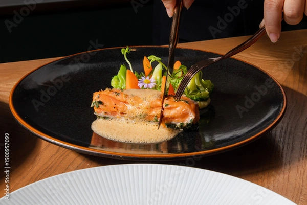 Fototapeta Grilled Salmon with Vegetables and Sauce on Black Plate