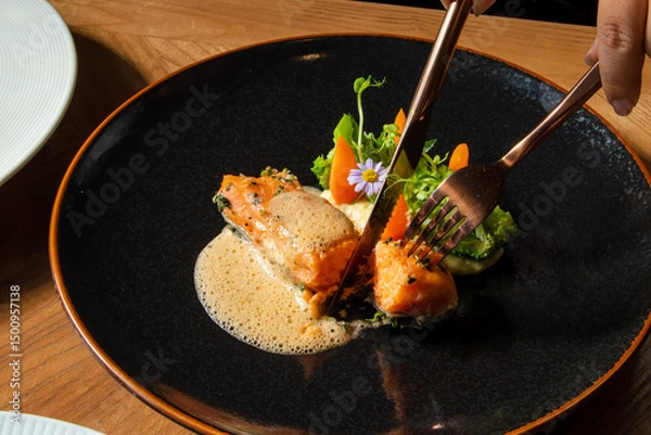 Fototapeta Grilled Salmon with Vegetables and Sauce on Black Plate
