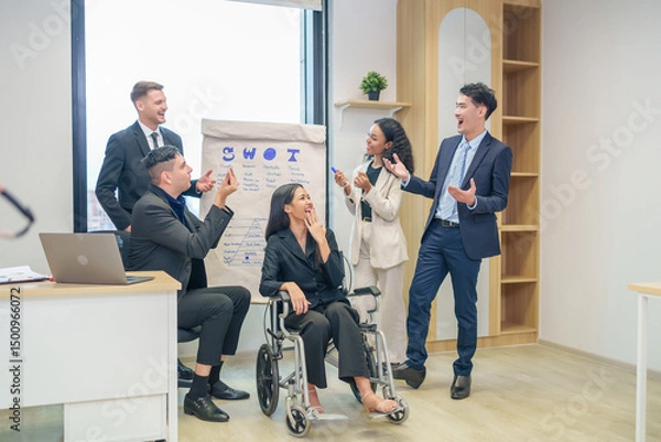 Obraz corporate diverse business people and business person with disability meeting, discussing,analysis new business strategy by using flipchart in boardroom