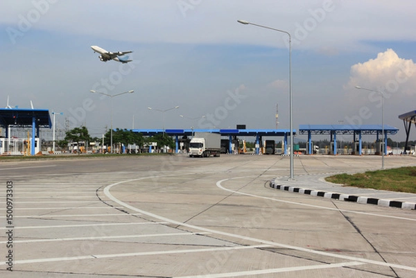 Obraz Import-Export.Container truck and cargo plane in ship port for business logistics and transportation.Shipping and transportation concept