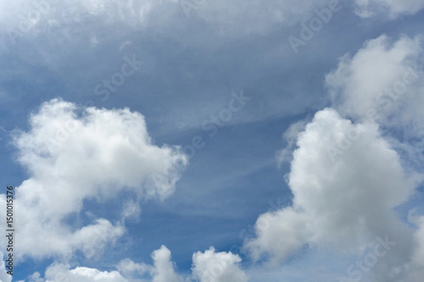 Obraz Beautiful Fluffy Clouds in a Bright Blue Sky