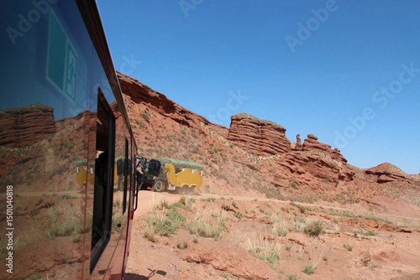 Fototapeta Beautiful landscape of Pingshan Hu Grand Canyon reflection in bus window, Zhangye City, Gansu Province in China