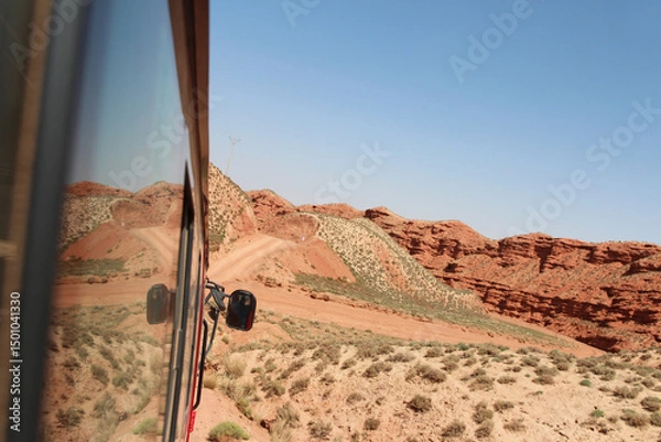 Fototapeta Beautiful landscape of Pingshan Hu Grand Canyon reflection in bus window, Zhangye City, Gansu Province in China