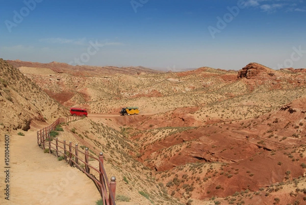 Fototapeta Beautiful landscape of Pingshan Hu Grand Canyon with the SUV car and mini bus in summer, Zhangye City, Gansu Province in China