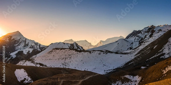Obraz Himalaya mountains at sunrise. Panoramic view of the trekking route to Thorong La pass against Chulu and Annapurna III summits.