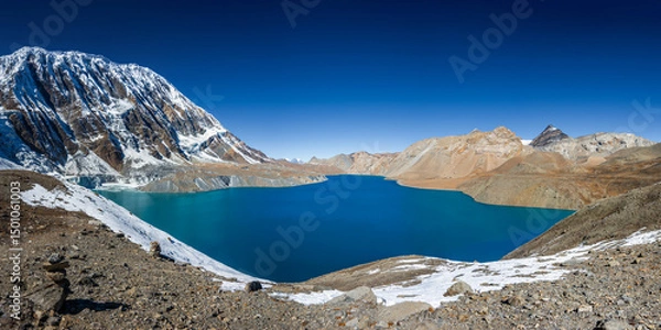Obraz Tilicho lake with still and bright blue water in calm weather in autumn sunny day. A sacred to Buddhists and Hindus lake in Himalaya mountain in Annapurna area, Nepal.