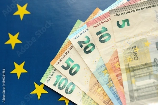 Fototapeta European union money currency Euro different paper notes on flag