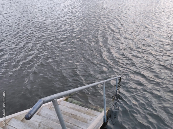Obraz A staircase leads down to the water