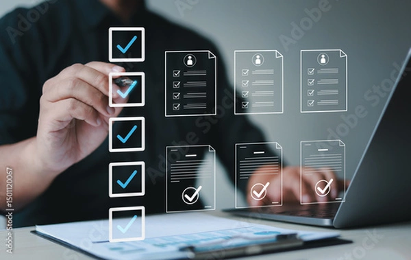 Fototapeta Male businessman doing online survey and digital form checklist with laptop computer, document management system, online document database and file management process.