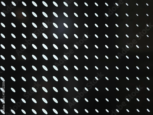 Obraz Modern abstract pattern with white ovals on black background, creating striking visual effect. This design can be used in various creative projects