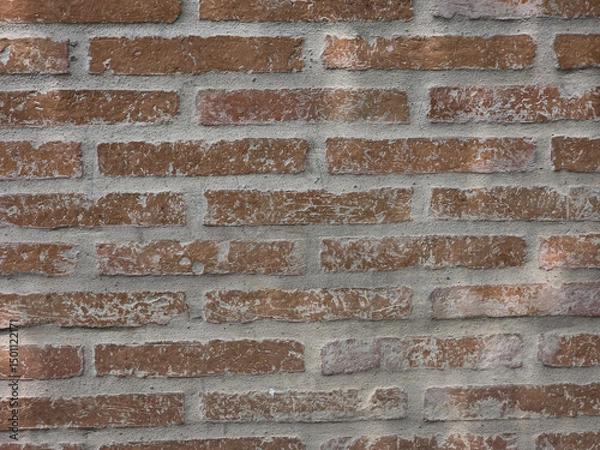 Obraz Textured brick wall with rustic appearance, featuring mix of red and gray tones, ideal for backgrounds or architectural designs