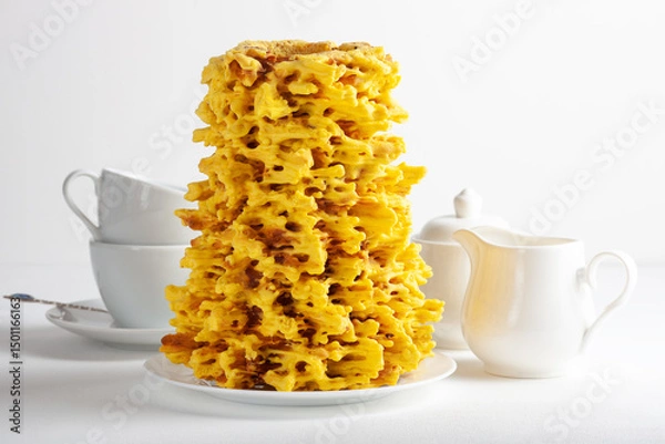 Obraz Sakotis tree cake with white tea set on light background