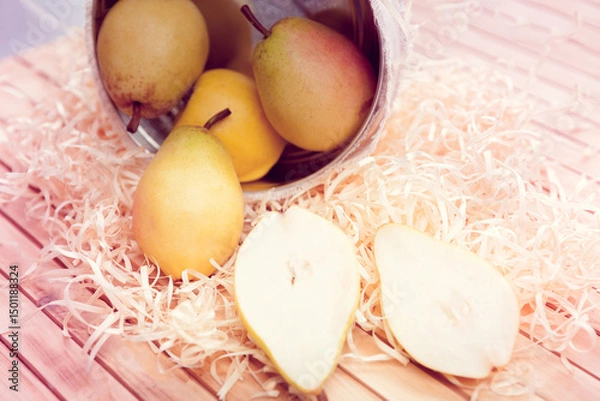 Fototapeta apples and pears rolled out of the basket