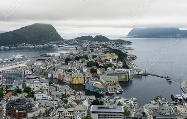 Fototapeta View of the historic city center of Ålesund on the west coast of Norway, with the surrounding fjords and islands under a cloudy sky