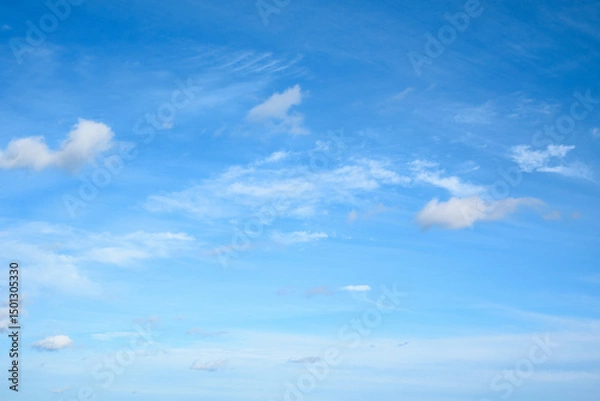 Fototapeta Light Blue Sky with White Clouds — Natural Background for Image Replacement and Design Use