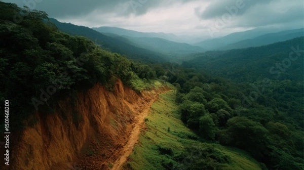 Obraz Scenic Overlook of Lush Green Mountains and Dramatic Cloudy Sky
