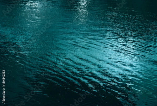Obraz Ripples and reflection of light, green water surface background with space for design