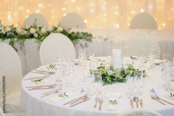 Fototapeta wedding table with exclusive floral arrangement prepared for reception, wedding or event centerpiece in greenery style