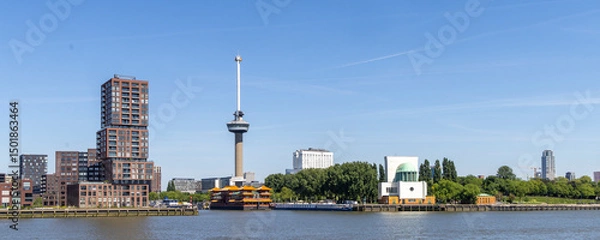 Fototapeta Panoramic skyline with famous Euromast tower, floating Chinese restaurant and Maas tunnel building in Rotterdam The Netherlands
