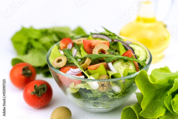 Fototapeta Healthy salad from fresh vegetables, greens, arugula and olives. Selective focus.