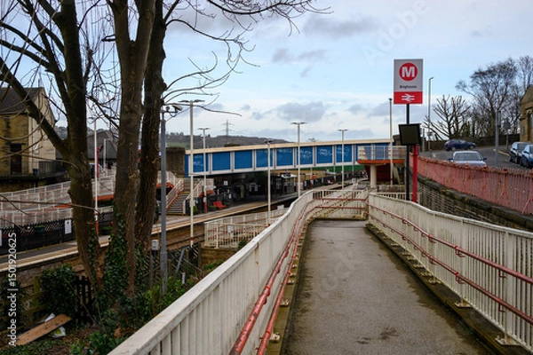 Fototapeta Pedestrian Ramp Leading to Brighouse Train Station Platforms in West Yorkshire, England.