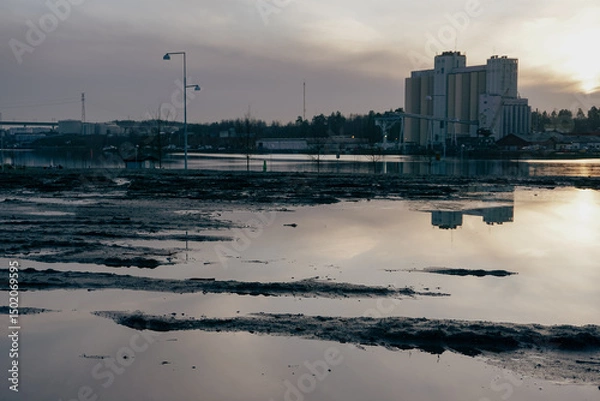 Obraz Factory at a river during evening