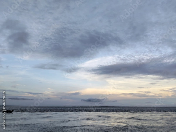 Fototapeta Cloudy sky and riverside view, The sky is cloudy and the ocean is calm