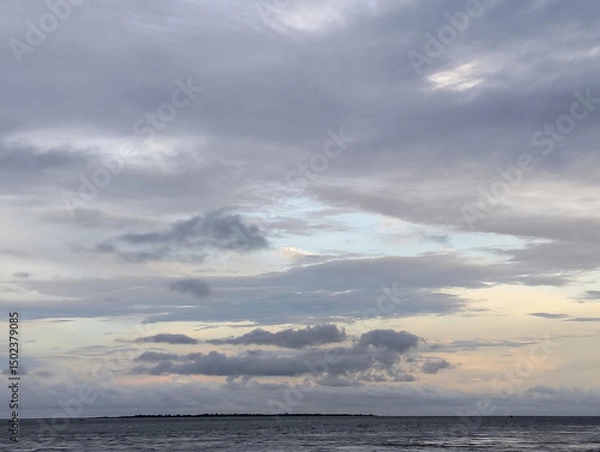 Fototapeta Cloudy sky and riverside view, The sky is cloudy and the ocean is calm