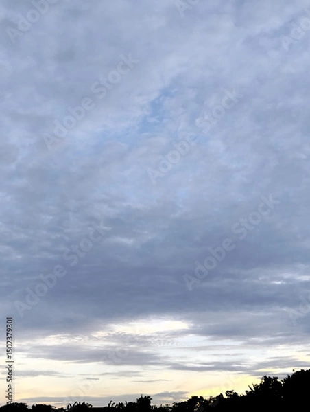 Fototapeta The sky is cloudy and the ocean is calm, Calm ocean waves rolling onto sandy beach under cloudy sky scenic view from above nature landscape seascape coastal scene