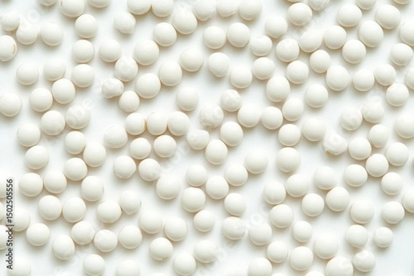 Fototapeta Top View of Abundant Heap of Soybeans on a White Surface: A Vegan Delight