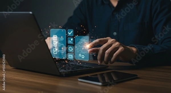 Fototapeta Person using laptop with digital interface displaying checklist and settings on a wooden desk surface