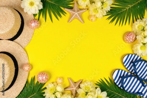 Fototapeta straw hat flip flops starfish seashells and flowers on a yellow background