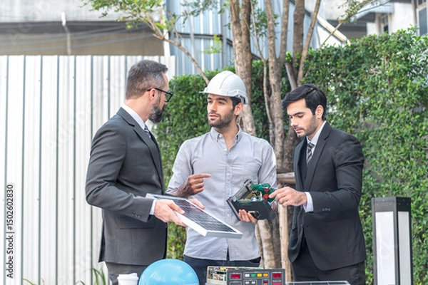Obraz Two Businessman and power engineering talking and checking quality power solar cell with laptop computor on site new project power solution business
