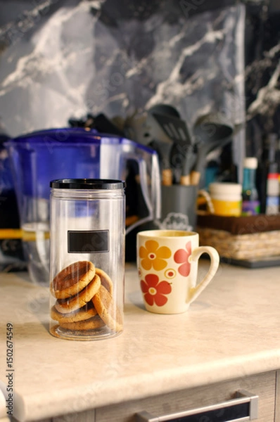 Fototapeta Cookies in a jar on the kitchen table.