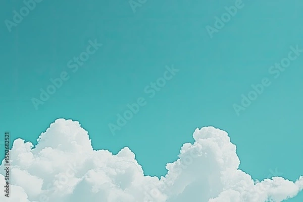 Fototapeta A bright turquoise sky with fluffy white clouds near the bottom of the frame