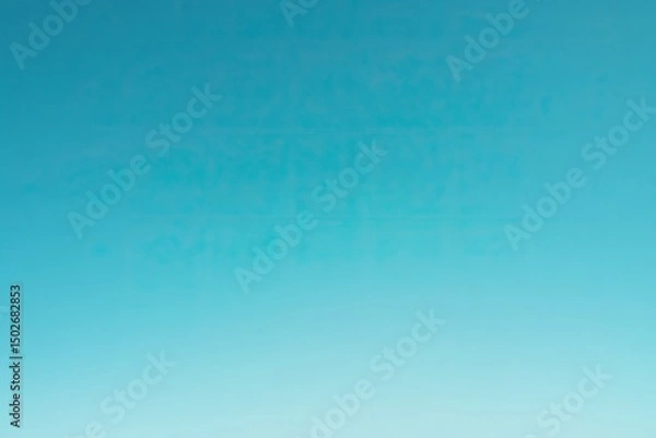 Fototapeta A soft, blurred sky gradient transitions from a pale blue to a vibrant turquoise