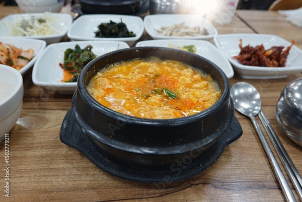 Fototapeta Korean Soft Tofu Stew in a Stone Pot with Side Dishes