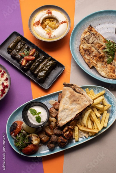 Fototapeta Traditional Lebanese mezze and grill platter with colorful, vibrant presentation.