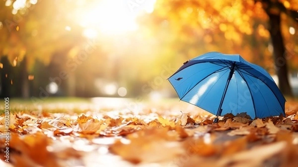 Obraz Autumnal Serenity: Blue Umbrella Amidst Golden Leaves