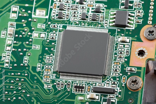 Fototapeta Electronic chip on a green circuit board close-up