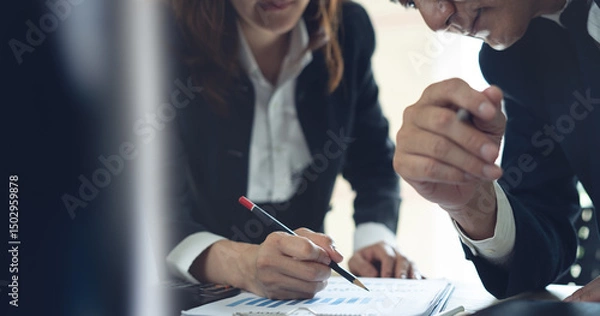 Obraz Business team have a discussion on financial report, business analyzing marketing data at office. Bookkeeping, document for financial planning, accounting and business budget management, close up