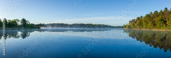 Obraz Panorama of a calm lake at dawn with pines on the shore in northern Minnesota