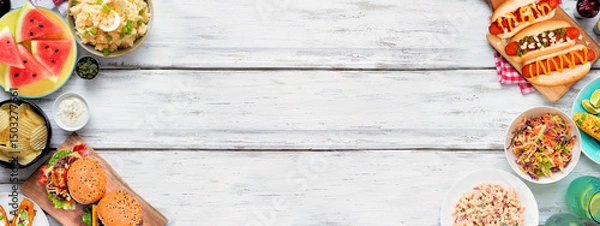 Obraz Summer food table scene with hot dogs, hamburger and sides. Above view double border over a white wood banner background. Copy space.