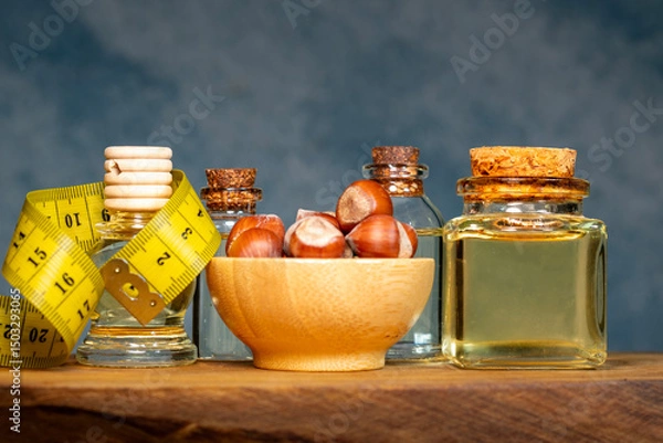 Obraz Finfik In a Wooden Plate and Hazelnut Oil in a Bottle