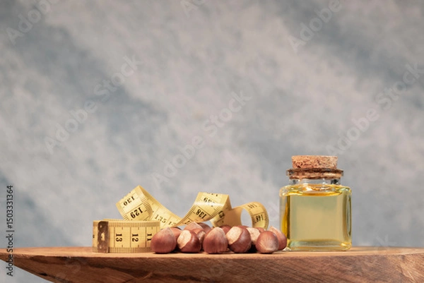 Obraz Finfik In a Wooden Plate and Hazelnut Oil in a Bottle