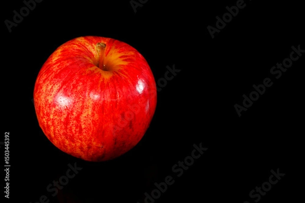 Fototapeta Apple isolated on black background closeup view copy space  