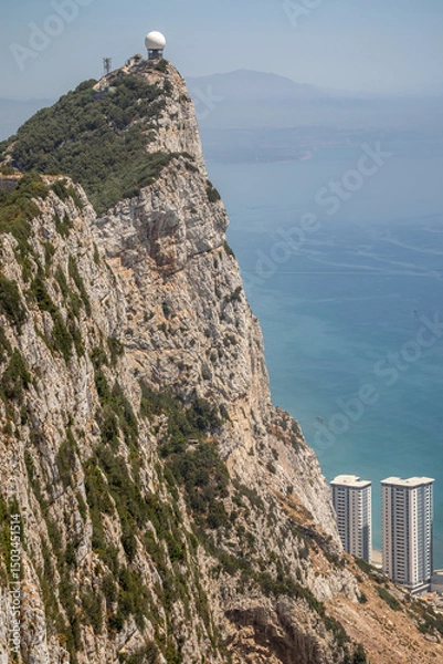 Fototapeta Rock of Gibraltar with Horizon and Sea. Beautiful Vertical Scenery of Stone Cliff with Water in Iberian Peninsula.