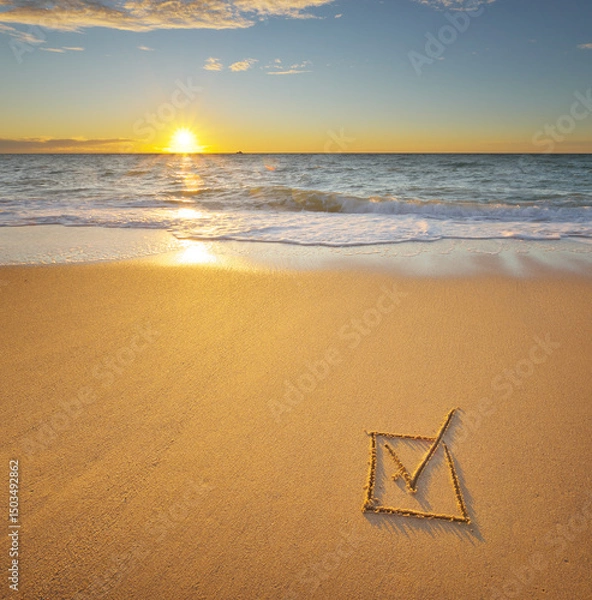 Obraz Check mark symbol in box on the beach shore during the sunset.