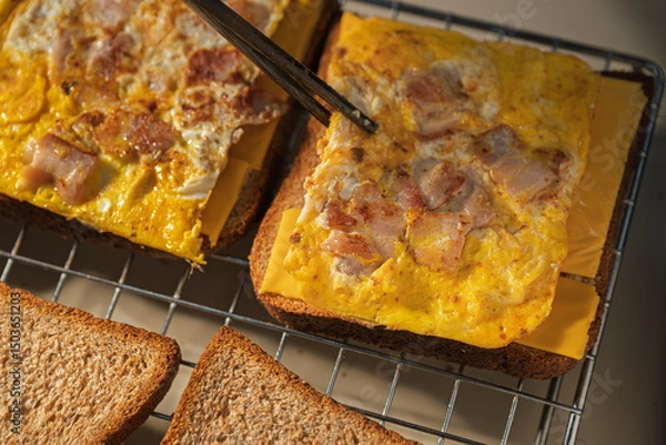 Fototapeta Delicious Bacon and Fried Egg Toast