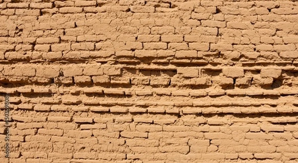 Fototapeta Ancient Adobe Brick Wall Texture: Awe-inspiring  Aged  Earth-toned Brickwork